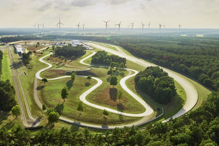 Aerial view of a route through green fields