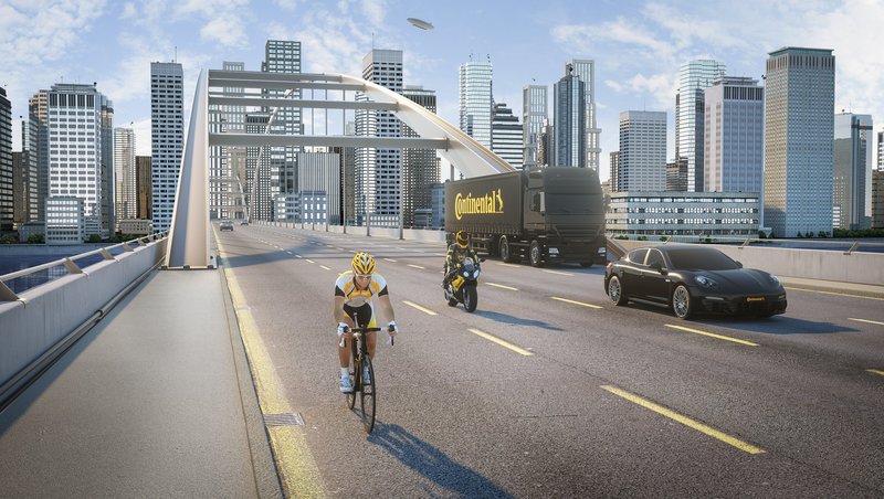 A truck, car, motorcycle and bicycle on a bridge
