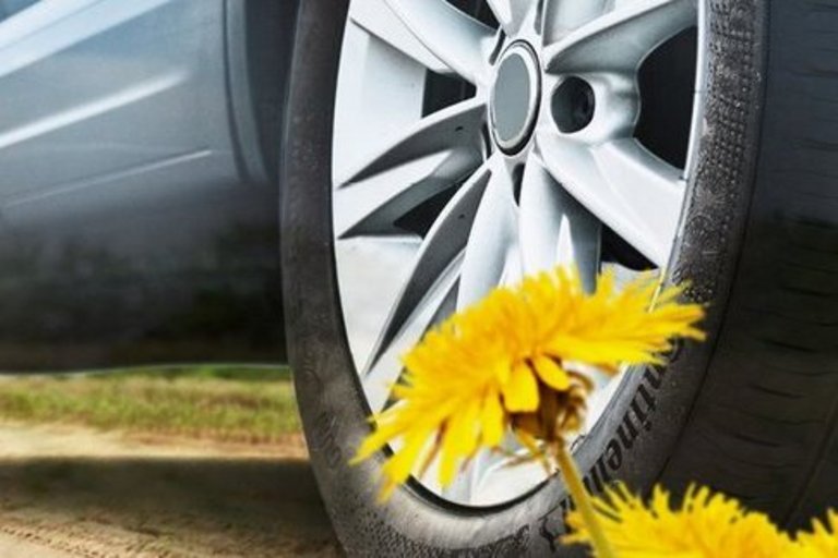 A composition of two hands scraping milk out of a jar, a tractor in a field and a car with a dandelion in front of it